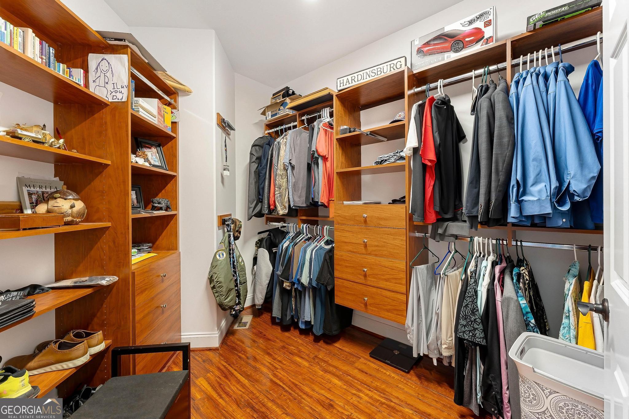 366 Curt Bailey Road Hartwell, GA 30643 - Photo 32 of 83 a view of walk in closet with clothes and shoes