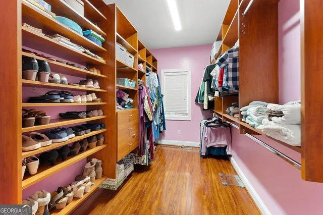 a bathroom with a sink a toilet a mirror and vanity