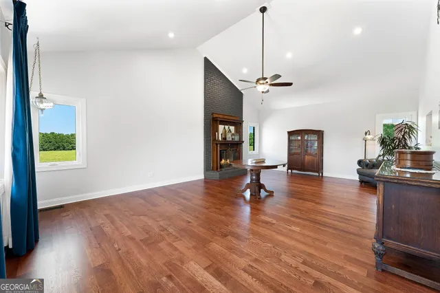 a bedroom with a bed and a view of kitchen