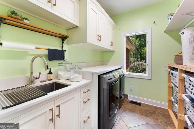 a spacious bathroom with a double vanity sink and a mirror