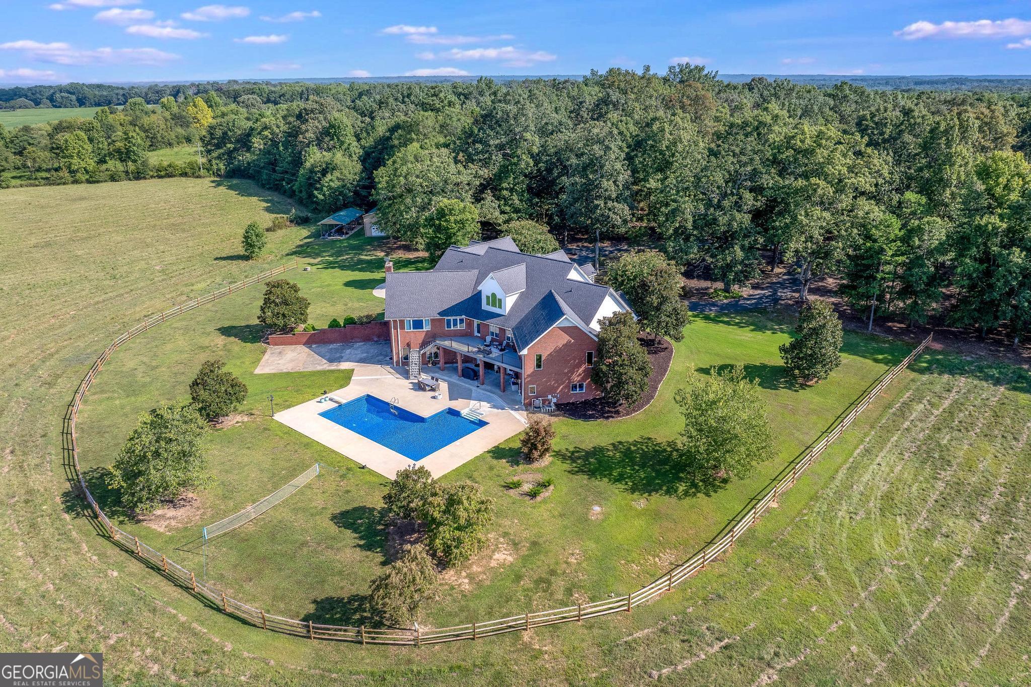 366 Curt Bailey Road Hartwell, GA 30643 - Photo 4 of 83 a view of a swimming pool with a yard and lake view