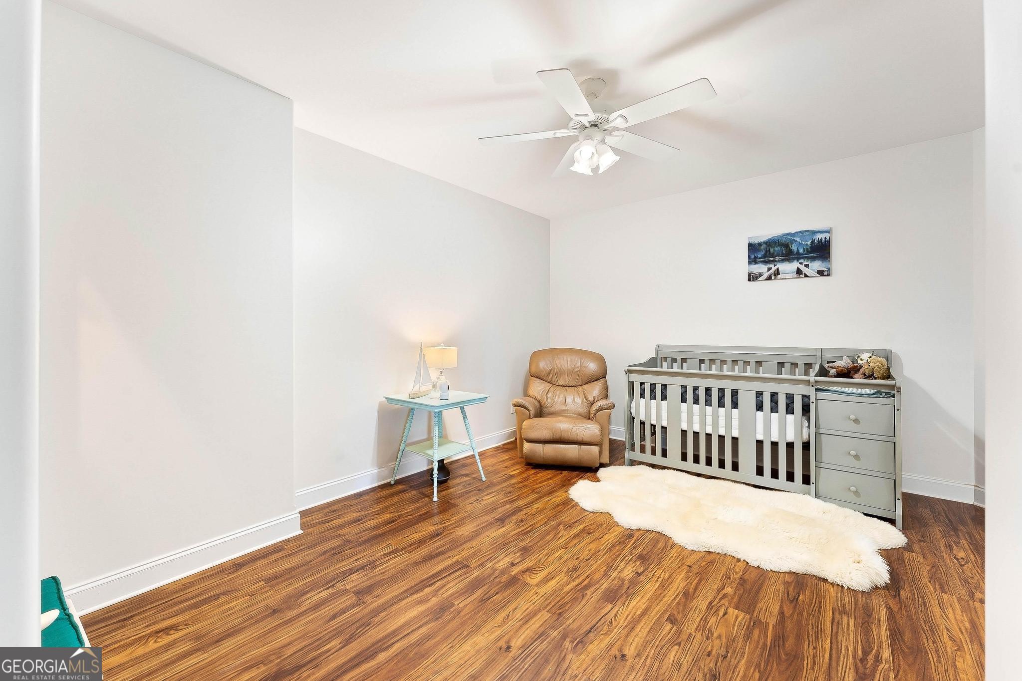 366 Curt Bailey Road Hartwell, GA 30643 - Photo 62 of 83 a bedroom with a bed and wooden floor