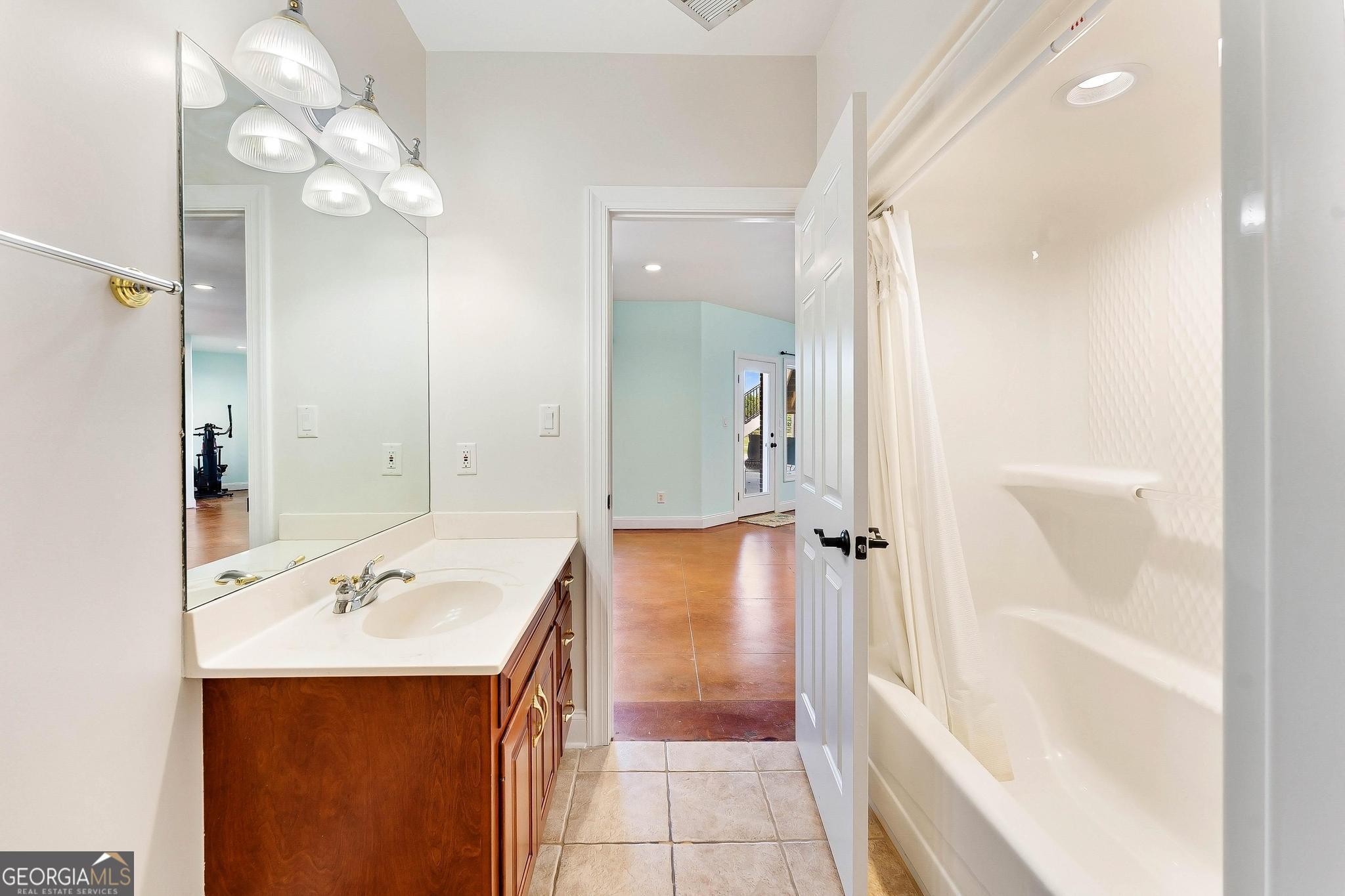 366 Curt Bailey Road Hartwell, GA 30643 - Photo 63 of 83 a bathroom with a tub sink and mirror