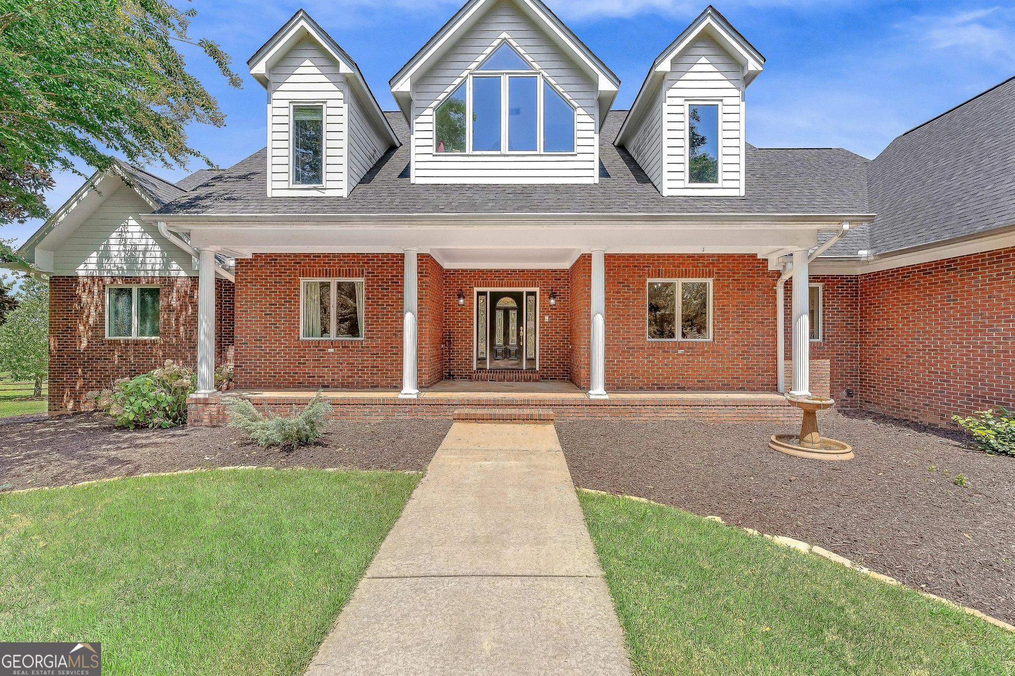 366 Curt Bailey Road Hartwell, GA 30643 - Photo 7 of 83 a front view of a house with a yard and garage
