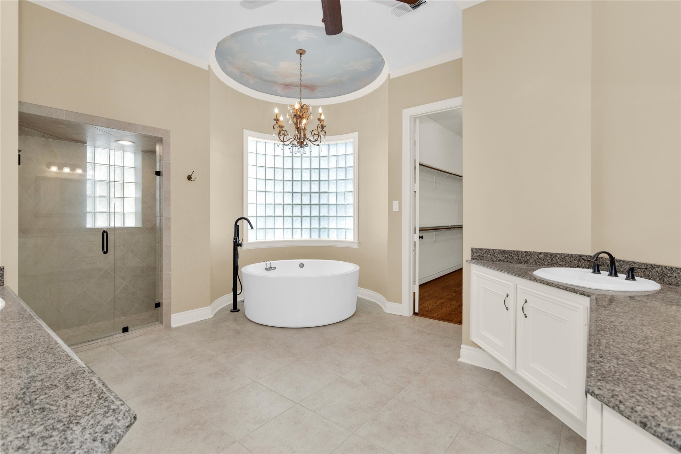 263 Saddle Ridge Spring, TX 77380 - Photo 14 of 50 Primary Bath with Large Soaking Tub, Separate Shower, Double Vanities and Spacious Walk-in Closet with Built-ins.
