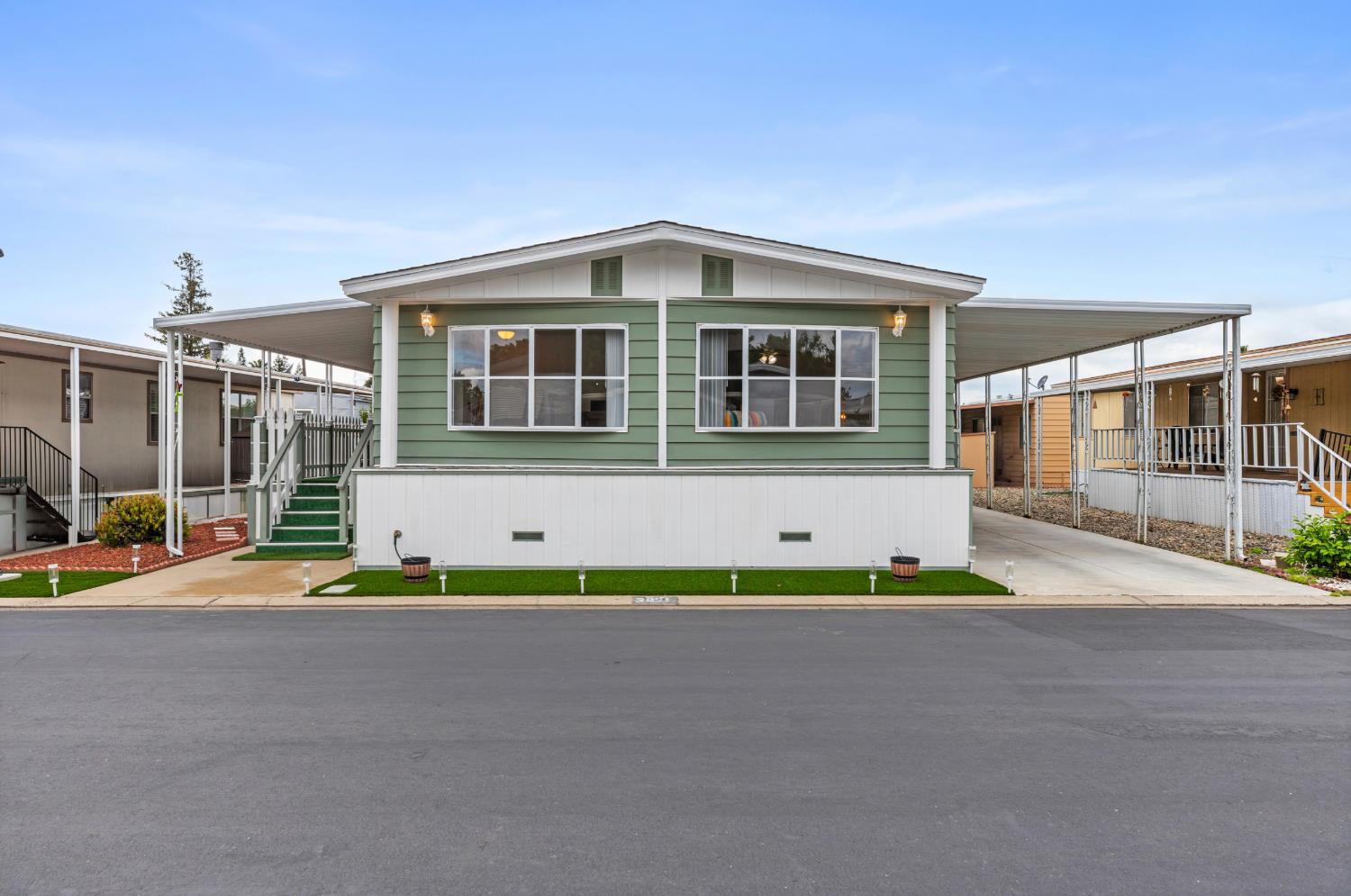 3921 Moana Way Modesto, CA 95355 - Photo 1 of 34 a front view of a house with a garden and plants