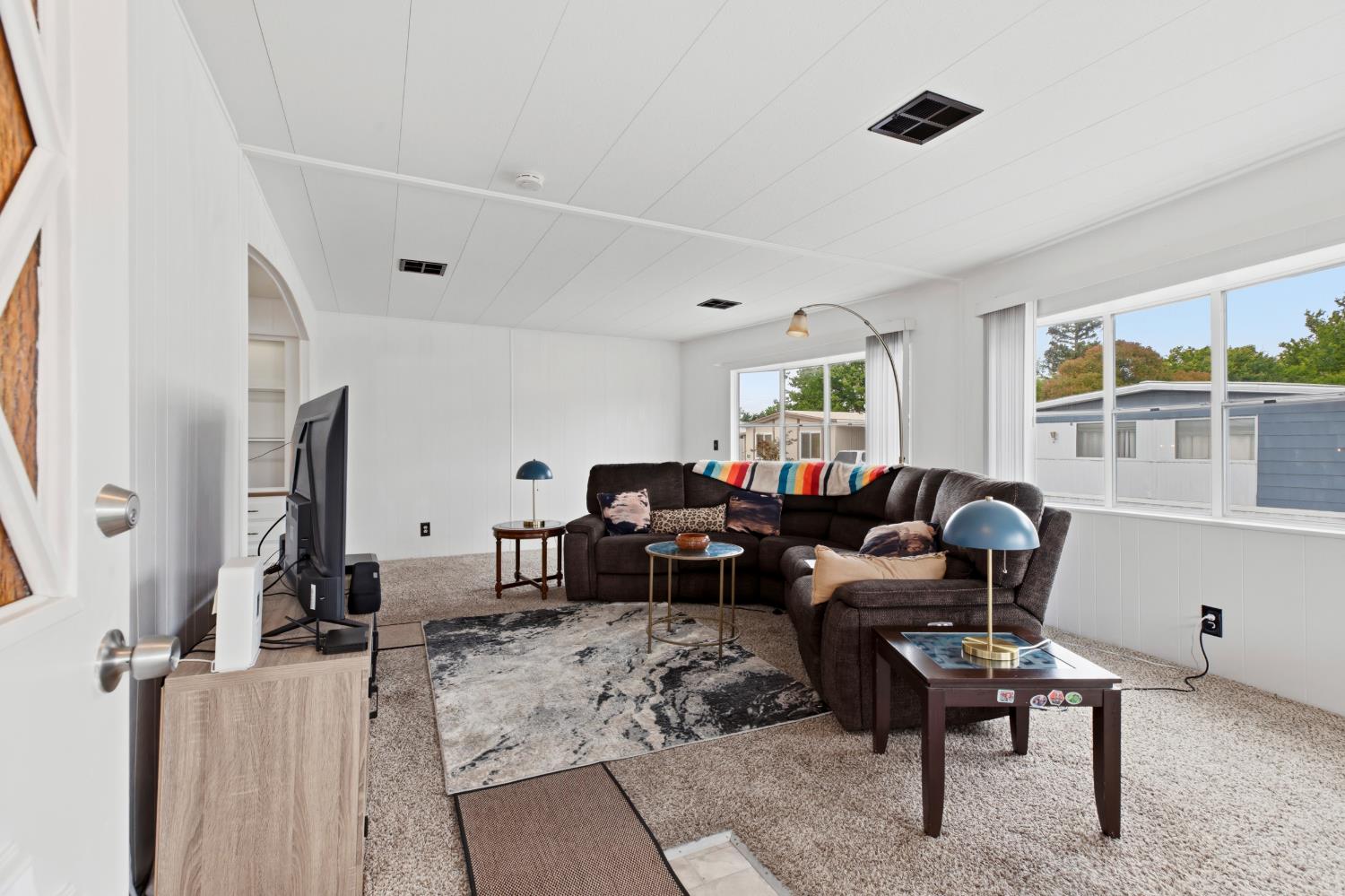 3921 Moana Way Modesto, CA 95355 - Photo 22 of 34 a living room with furniture a rug and a window
