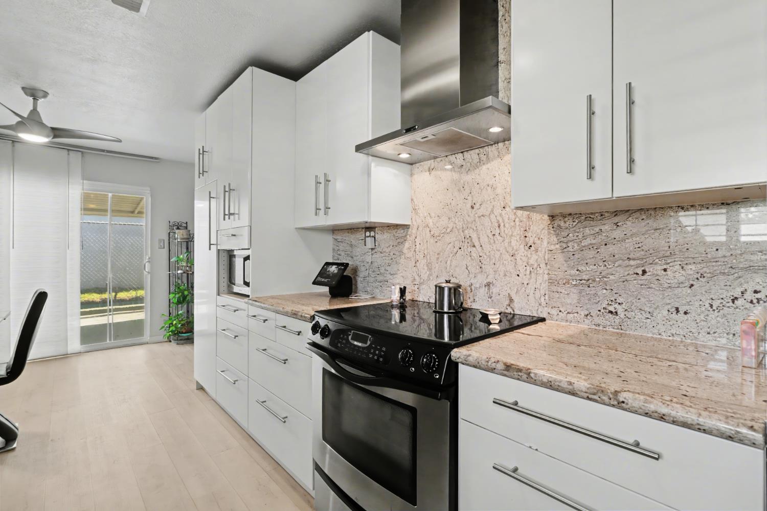 10500 Spaulding Way Rancho Cordova, CA 95670 - Photo 14 of 39 a kitchen with stainless steel appliances granite countertop a sink stove and refrigerator