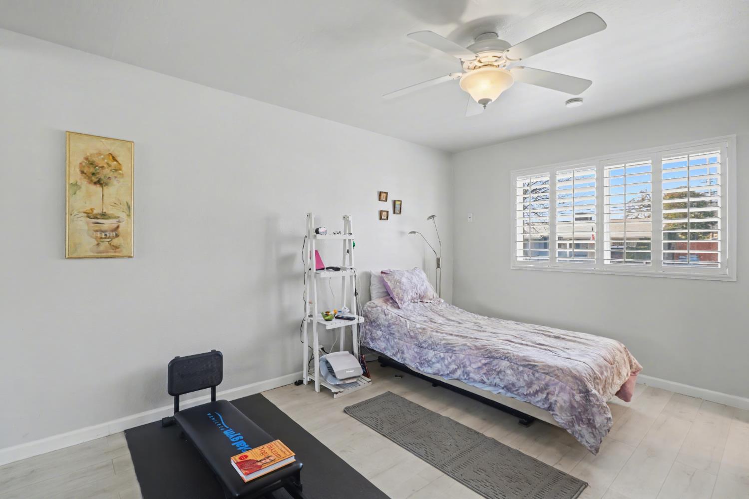 10500 Spaulding Way Rancho Cordova, CA 95670 - Photo 15 of 39 a bedroom with a bed and a window