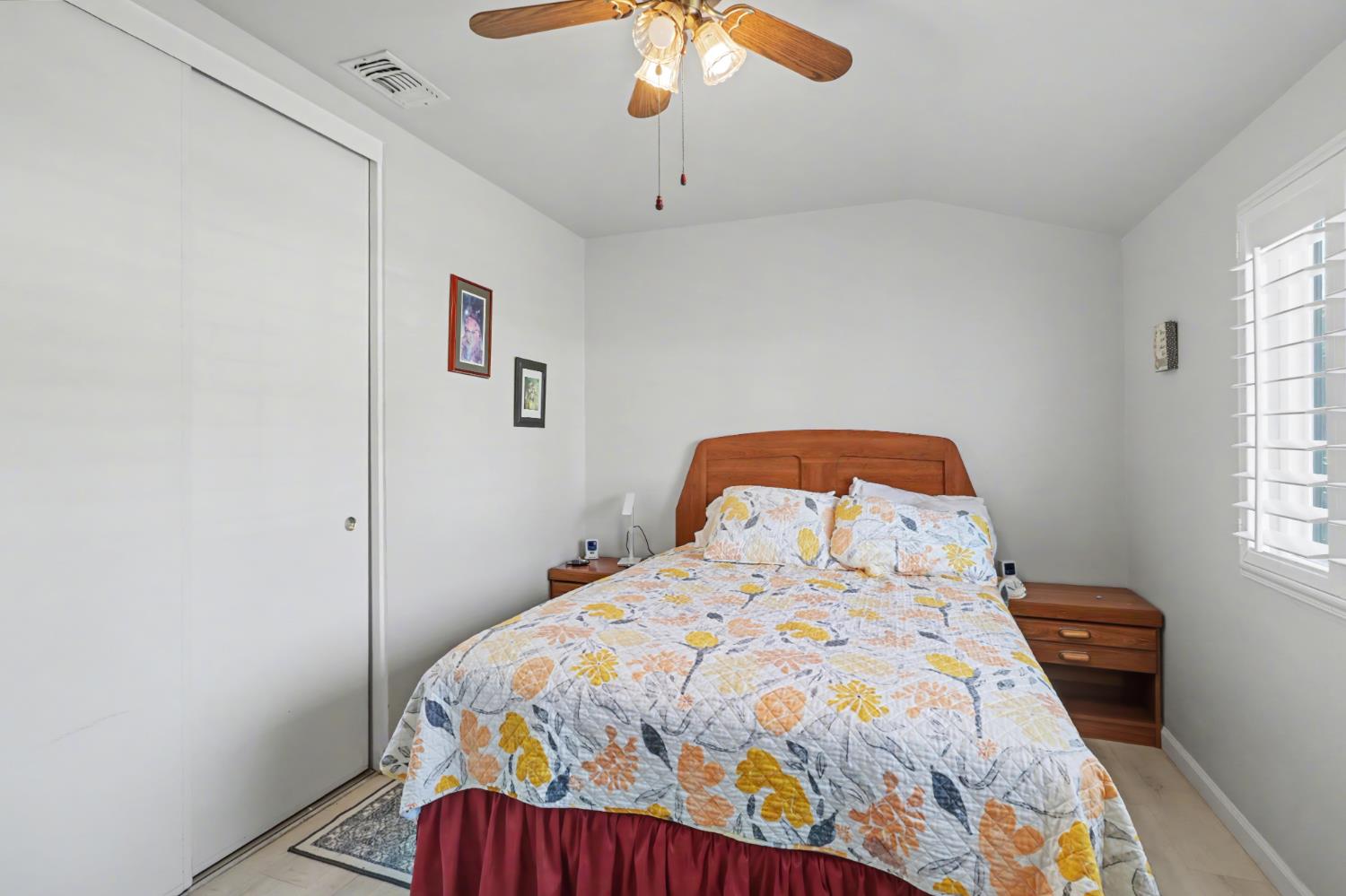 10500 Spaulding Way Rancho Cordova, CA 95670 - Photo 20 of 39 a bedroom with a bed and a chandelier