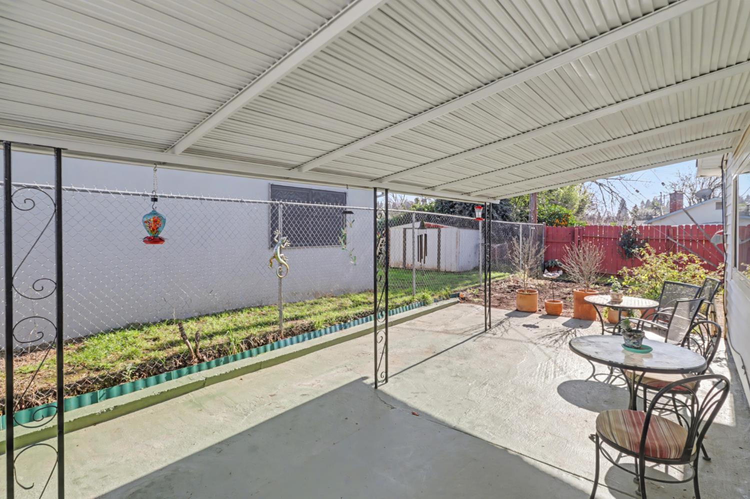 10500 Spaulding Way Rancho Cordova, CA 95670 - Photo 26 of 39 a view of a patio with table and chairs and potted plants