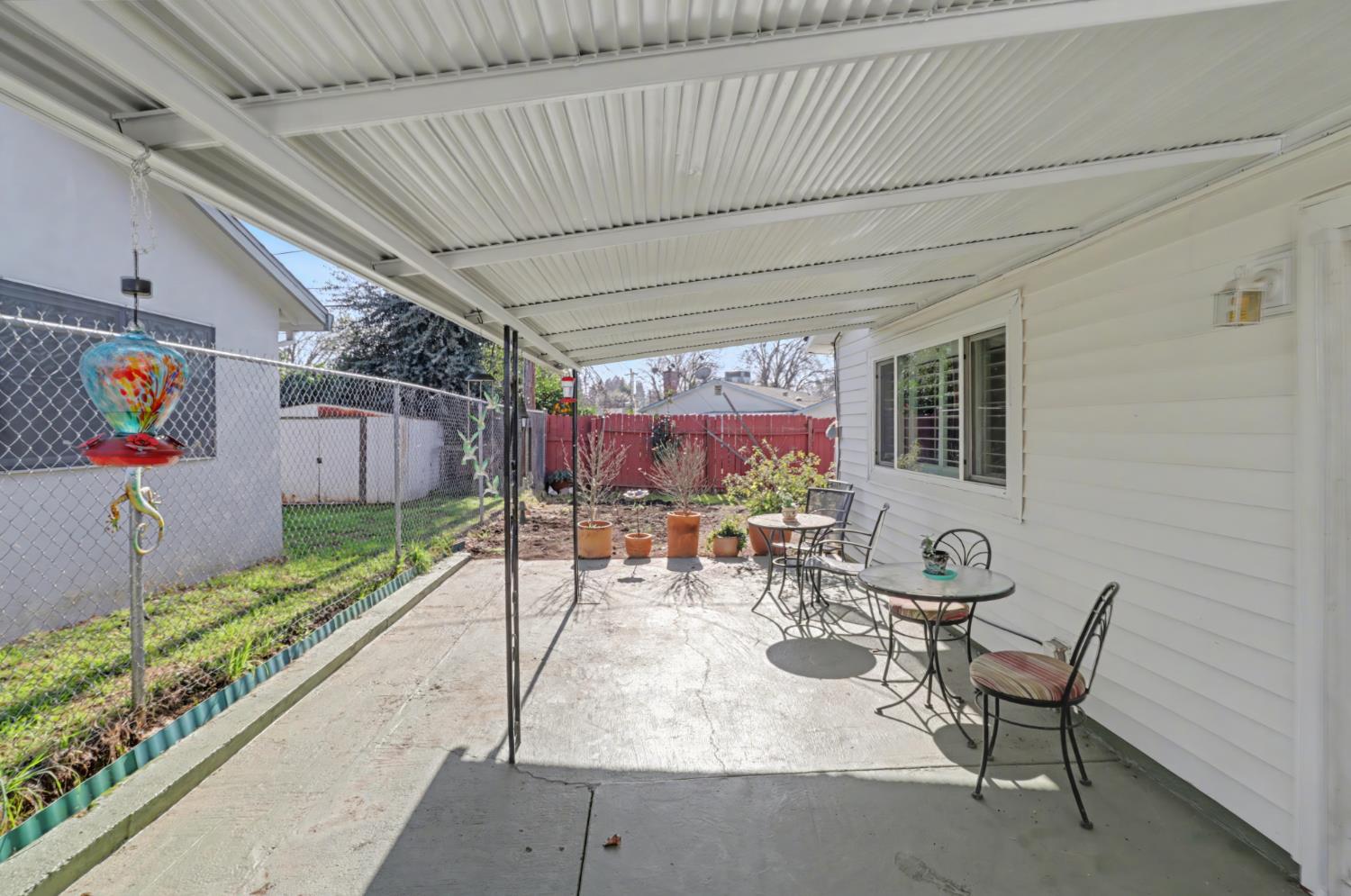 10500 Spaulding Way Rancho Cordova, CA 95670 - Photo 27 of 39 a view of a patio with table and chairs potted plants with wooden floor