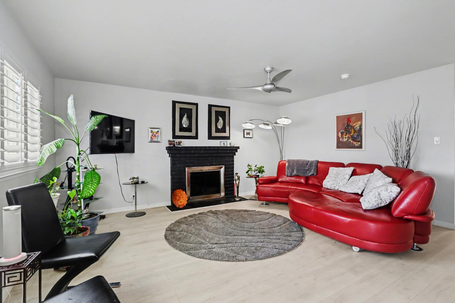 10500 Spaulding Way Rancho Cordova, CA 95670 - Photo 3 of 39 a living room with furniture a flat screen tv and a fireplace