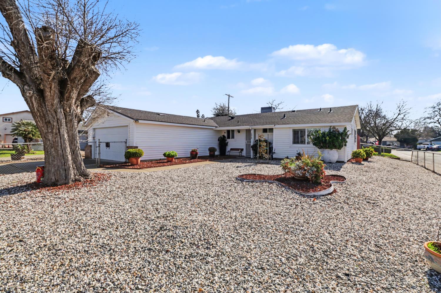 10500 Spaulding Way Rancho Cordova, CA 95670 - Photo 36 of 39 a view of a couches and a table and chairs under an umbrella