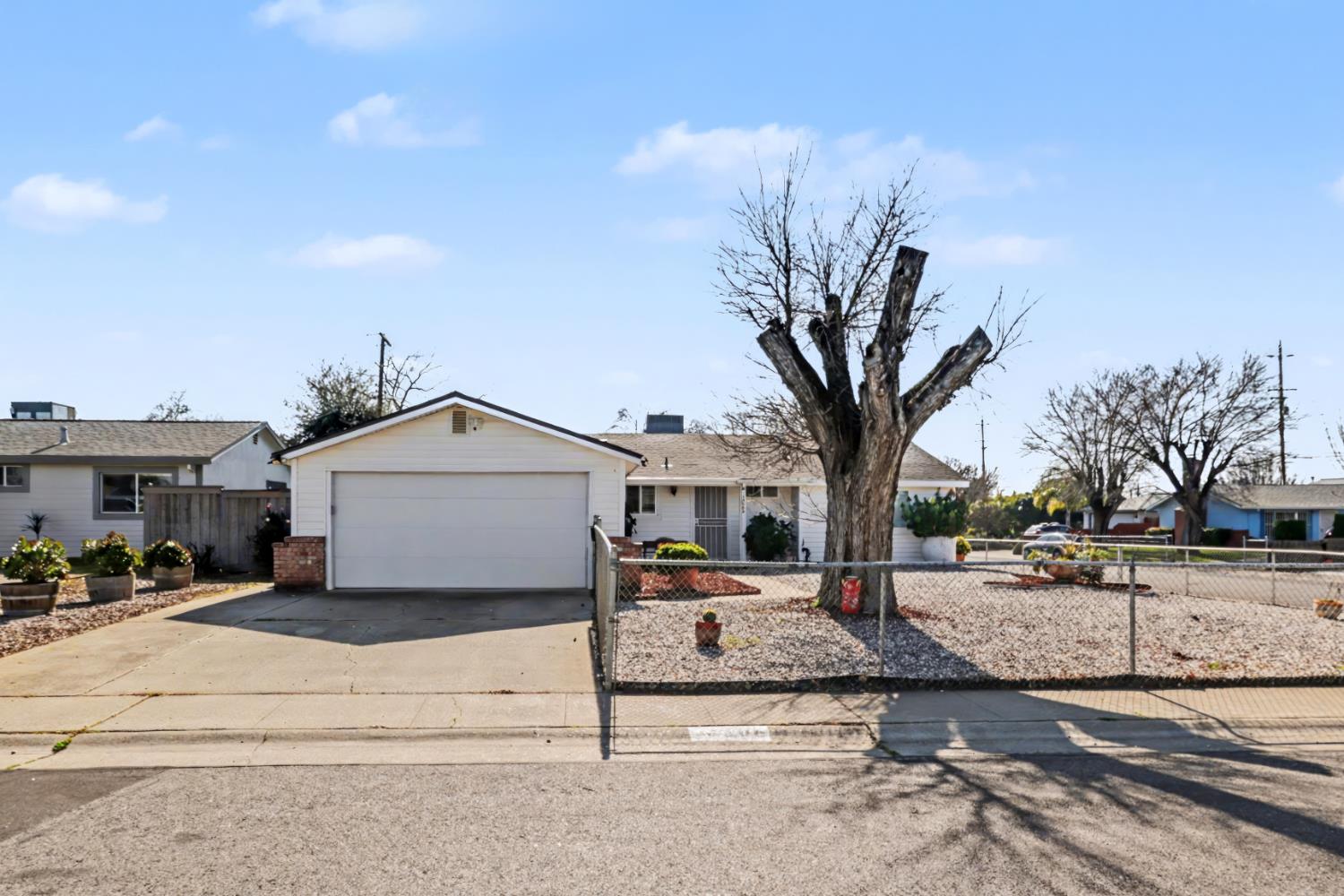 10500 Spaulding Way Rancho Cordova, CA 95670 - Photo 38 of 39 a white house that has a tree in front of it