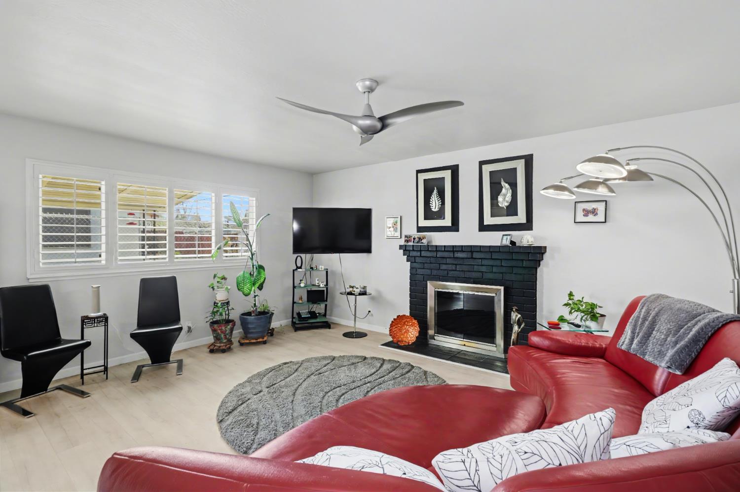 10500 Spaulding Way Rancho Cordova, CA 95670 - Photo 5 of 39 a living room with furniture fireplace and a flat screen tv