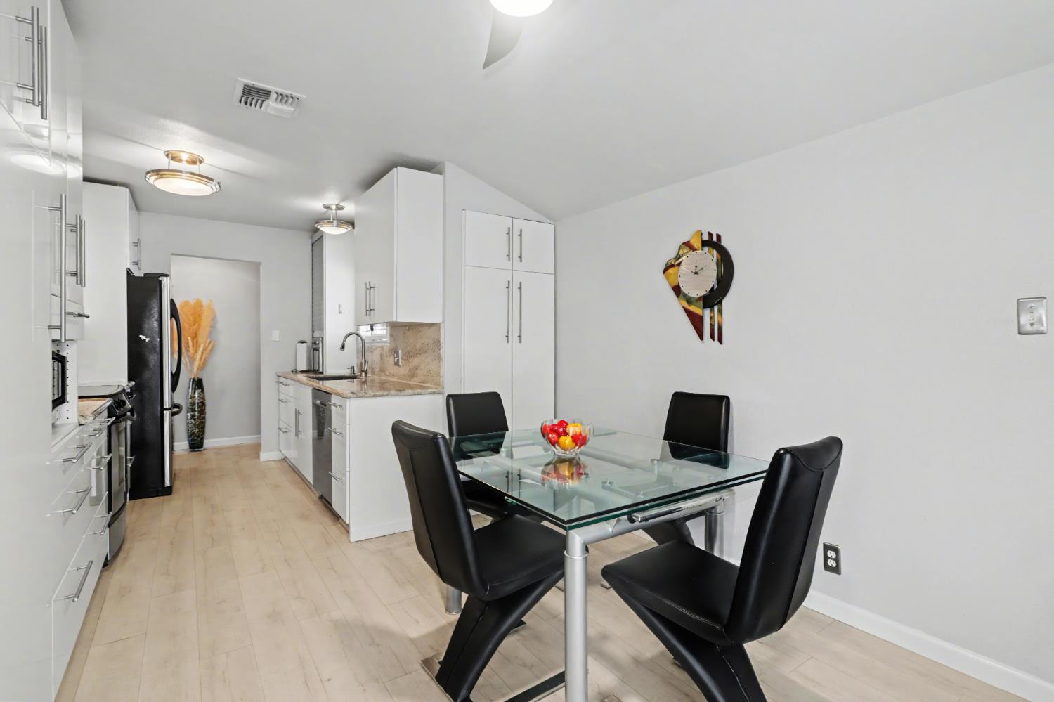 10500 Spaulding Way Rancho Cordova, CA 95670 - Photo 9 of 39 a workspace with furniture and a kitchen