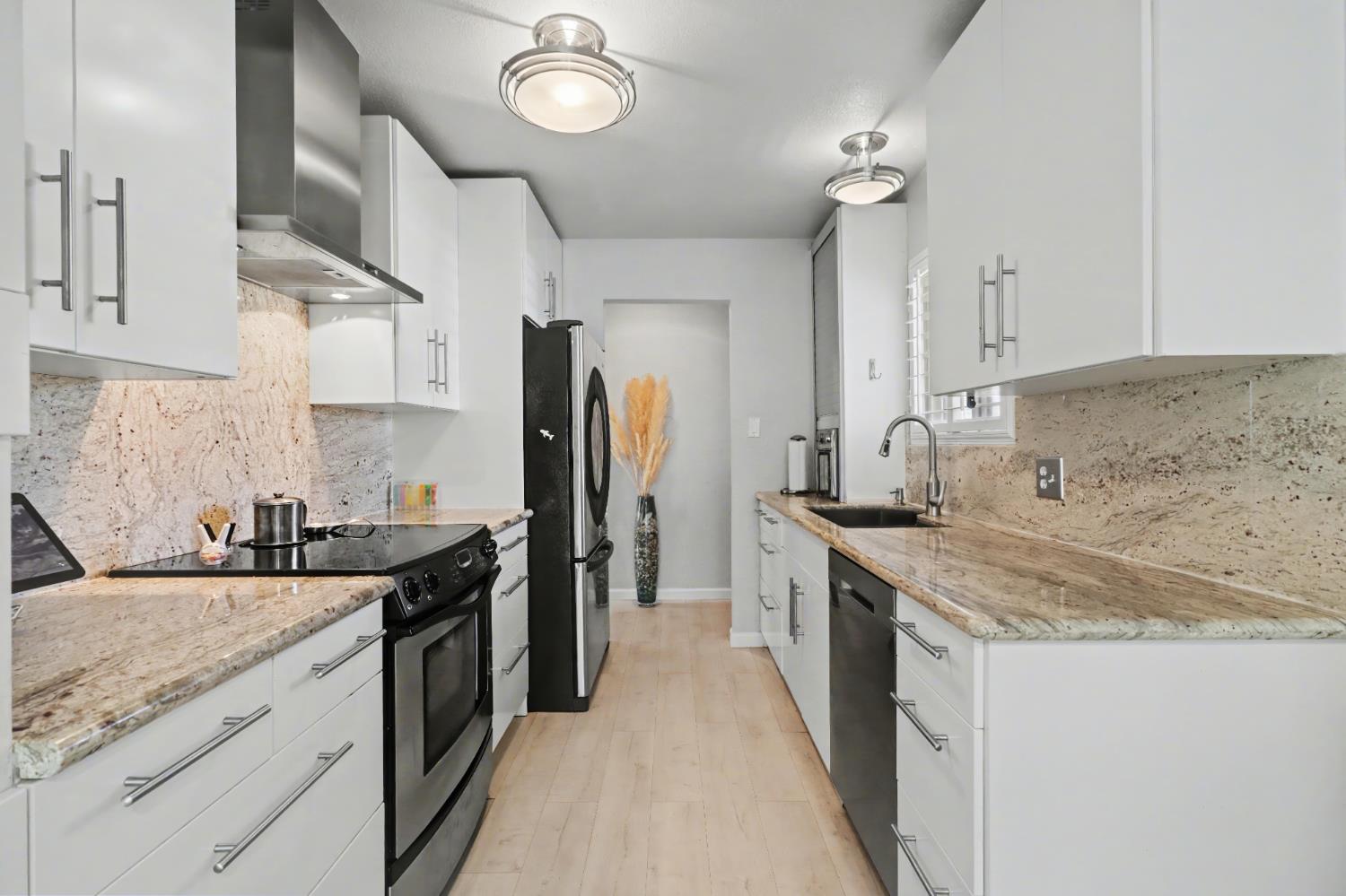 10500 Spaulding Way Rancho Cordova, CA 95670 - Photo 10 of 39 a kitchen with a sink stove and refrigerator