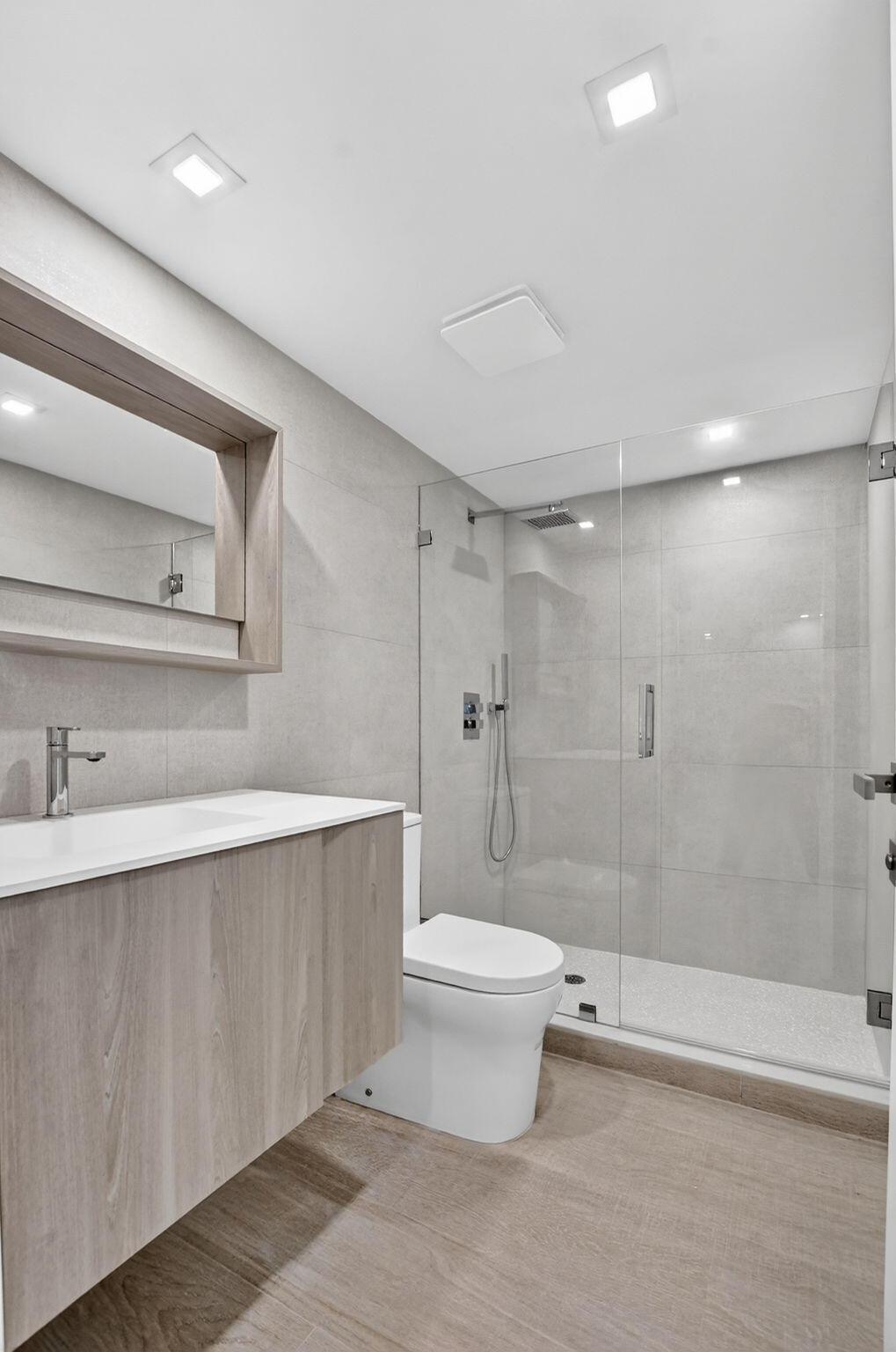 7835 Lakeside Boulevard, Unit 946 Boca Raton, FL 33434 - Photo 18 of 20 a bathroom with a sink a toilet and shower
