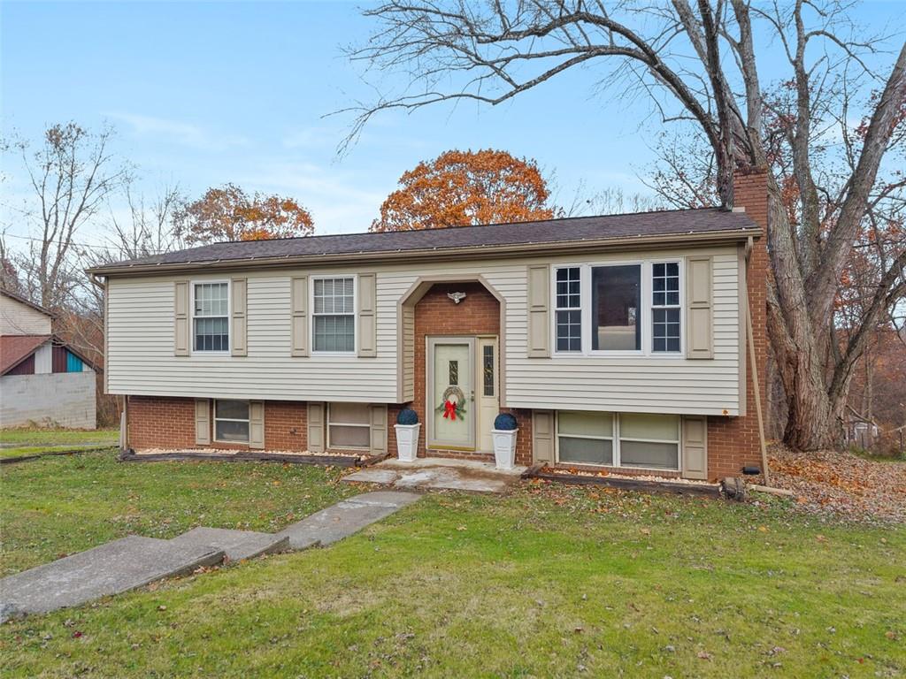 a front view of a house with a yard