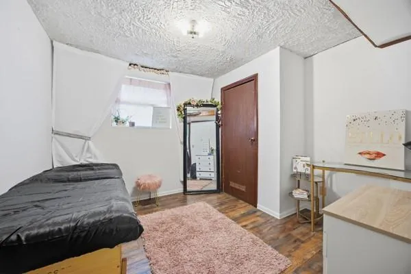 a bathroom with a toilet a sink and a shower curtain