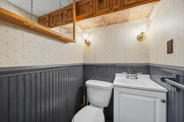 a living room with furniture and a ceiling fan