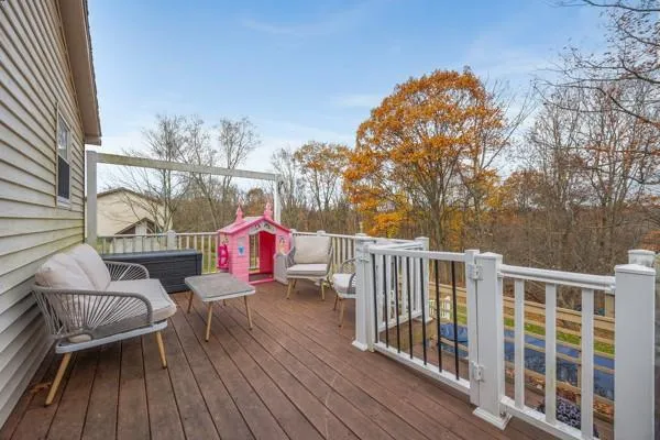 a view of a backyard with wooden fence