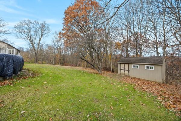 890 Grandview Road Ellwood City, PA 16117 - Photo 33 of 33 a backyard of a house with large trees and wooden fence