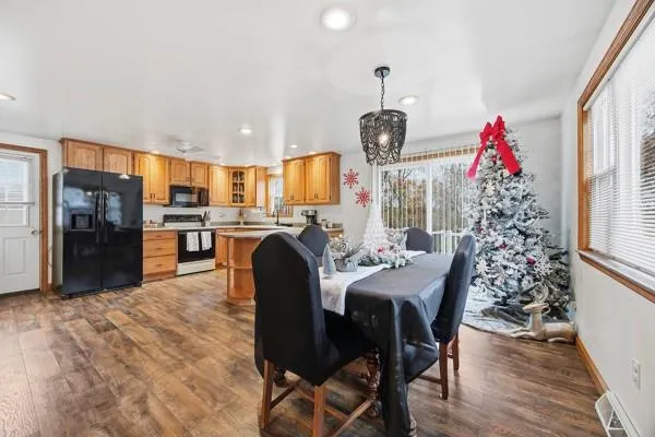 a view of a dining room with furniture window and wooden floor