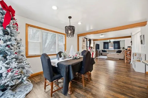 a view of a dining room with furniture window and wooden floor