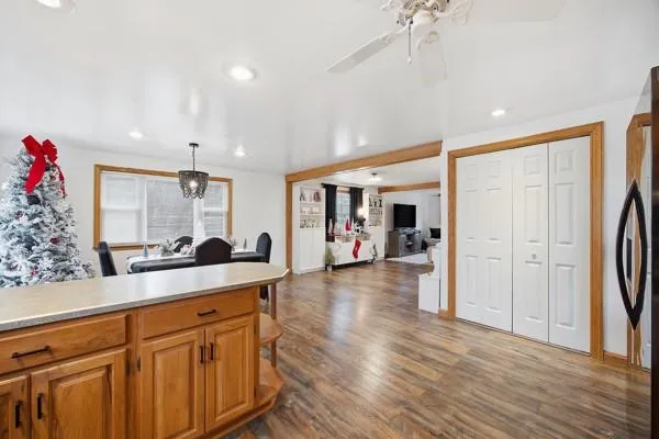 a open kitchen with stainless steel appliances granite countertop a refrigerator and a sink