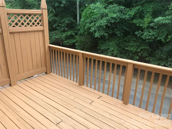 a balcony with wooden floor