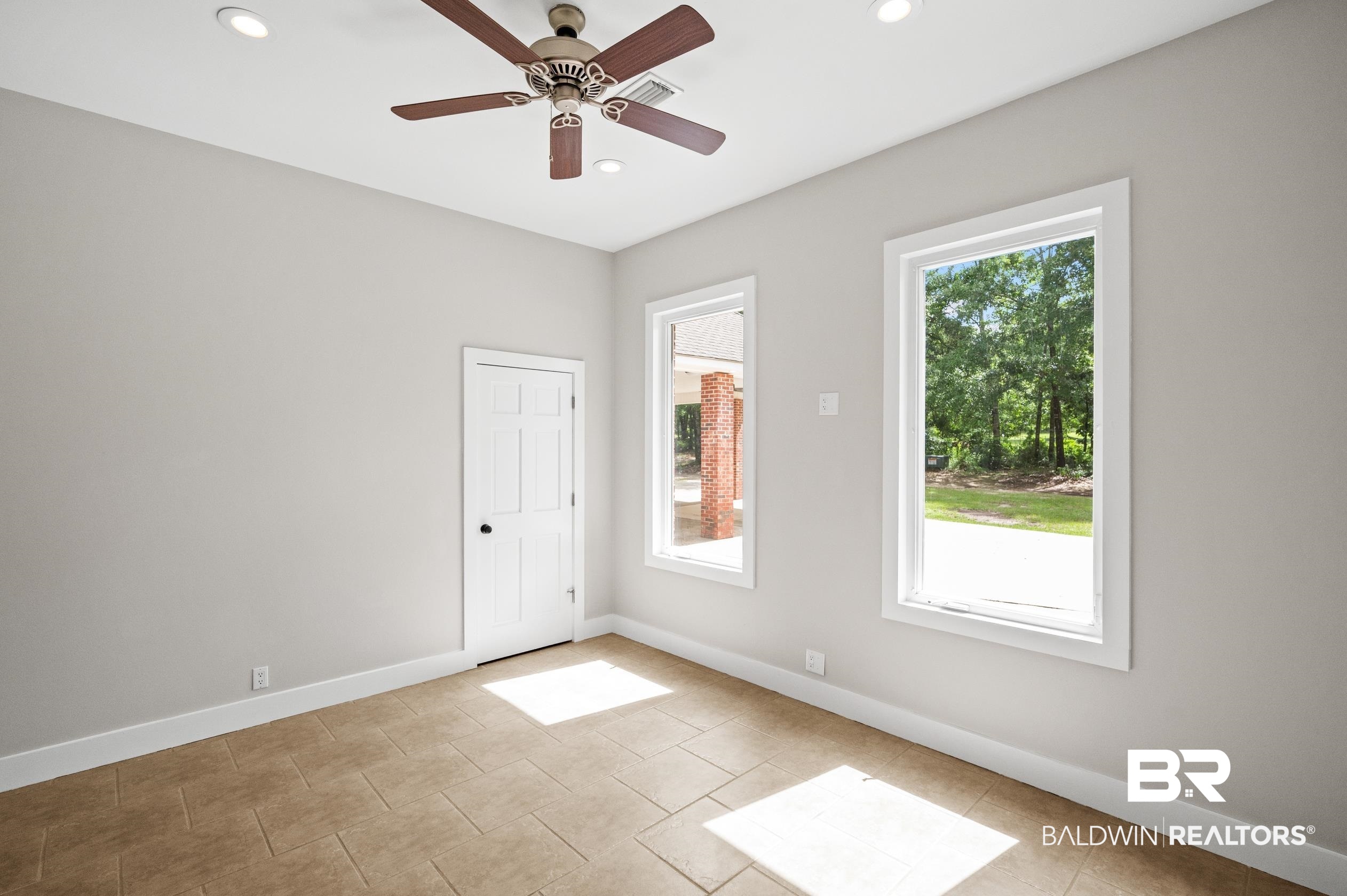 15031 Timber Ridge Drive Loxley, AL 36551 - Photo 36 of 43 Tiled spare room featuring plenty of natural light and ceiling fan