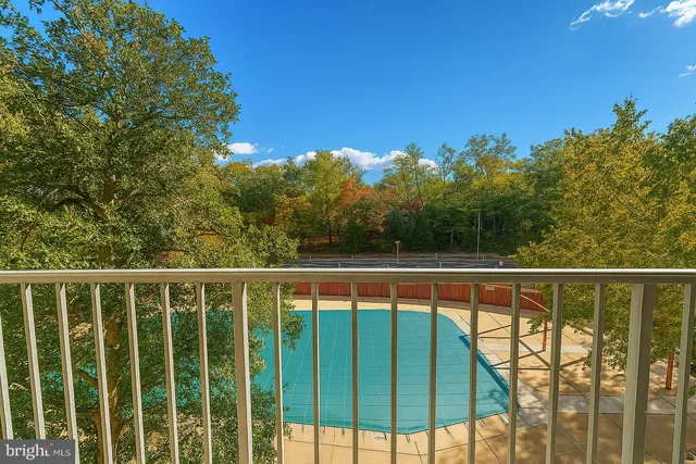 a view of a balcony with wooden floor