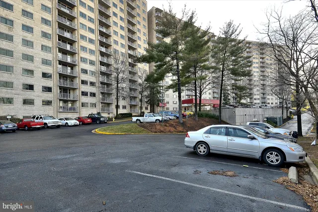 a living room with furniture and large windows