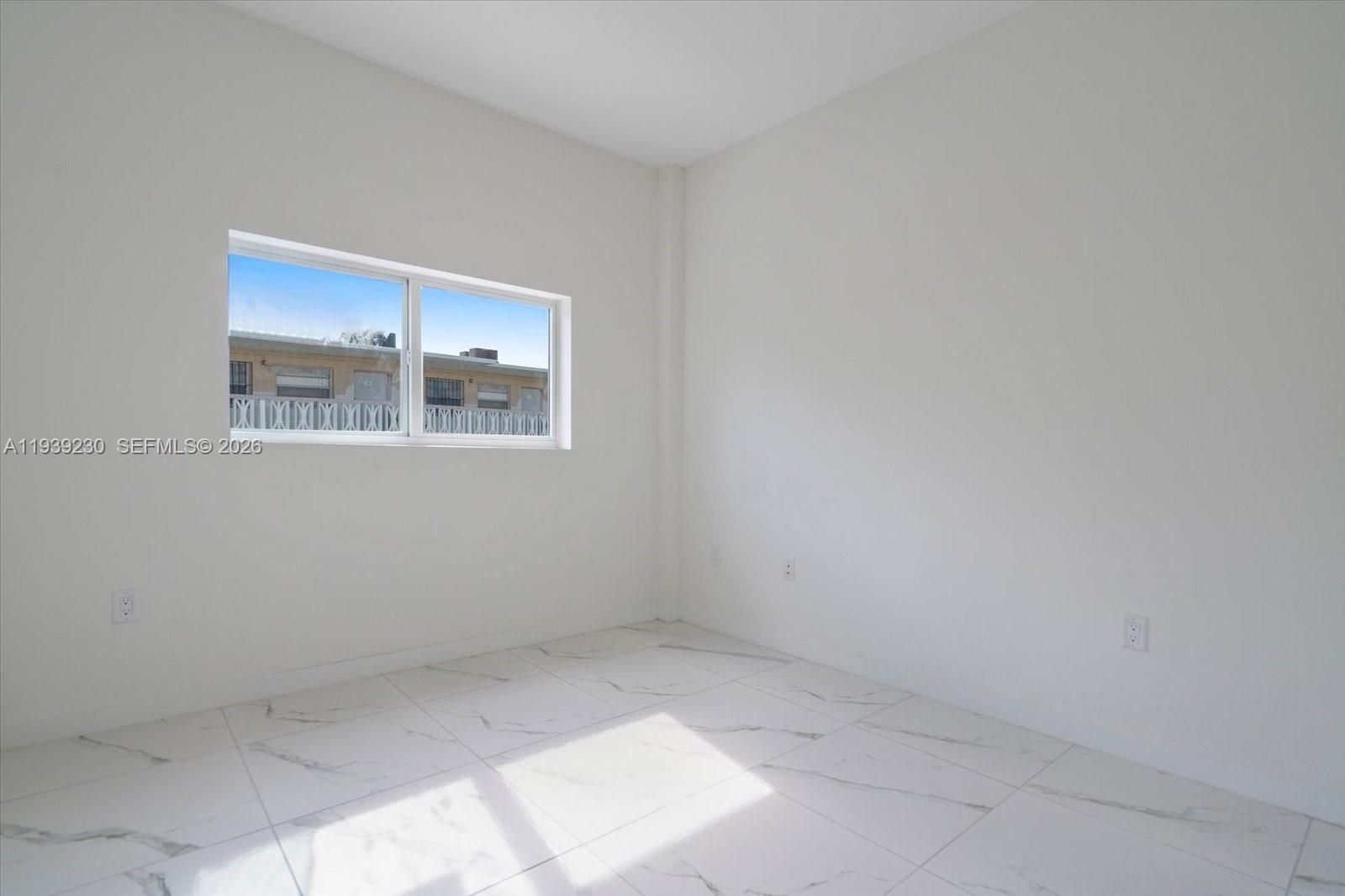 420 Southwest 7th Avenue, Unit 202 Miami, FL 33130 - Photo 11 of 19 an empty room with a window