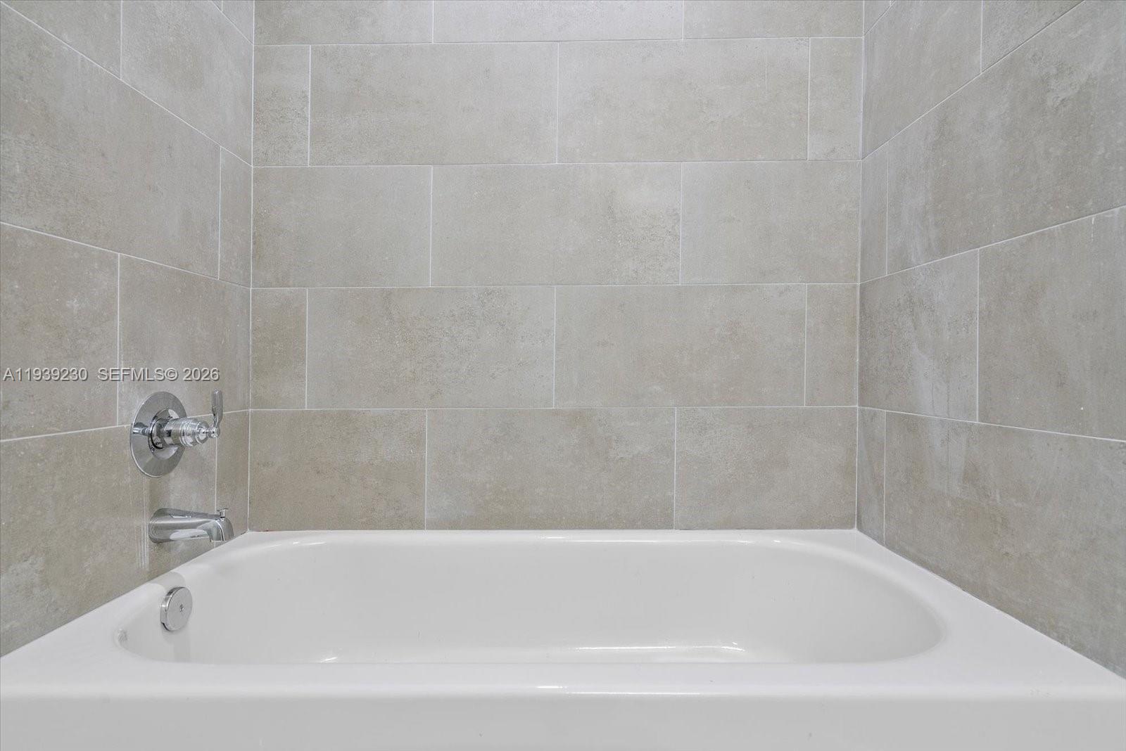 420 Southwest 7th Avenue, Unit 202 Miami, FL 33130 - Photo 14 of 19 a bathroom with a bathtub