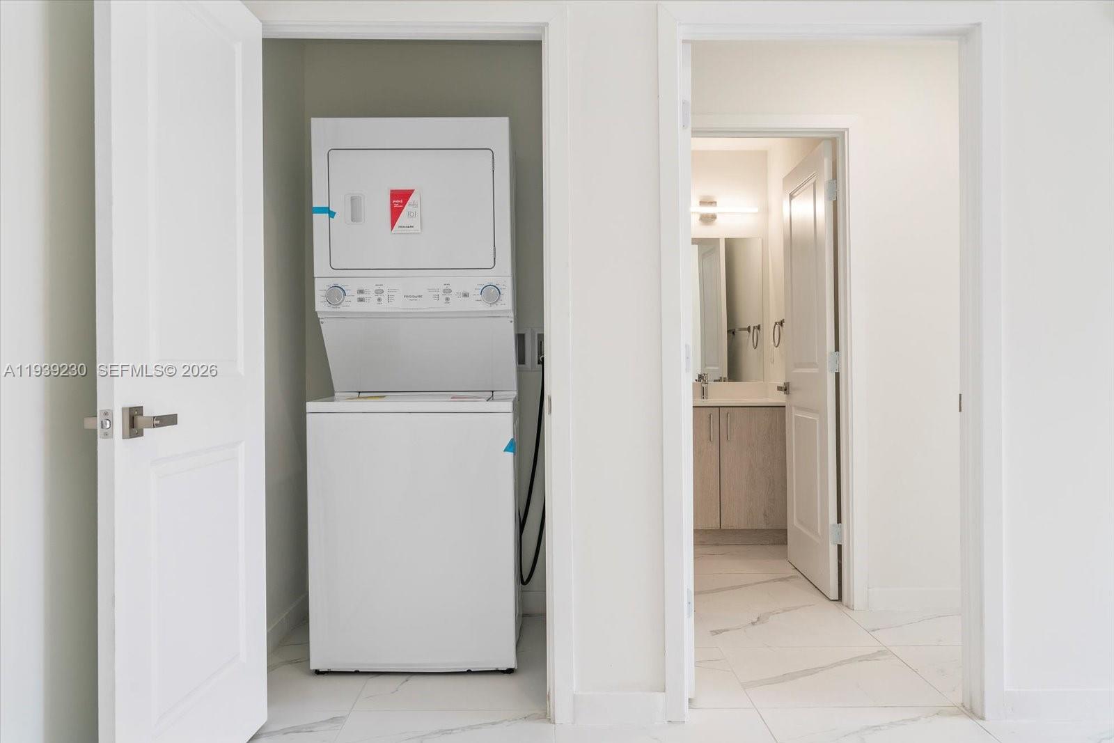 420 Southwest 7th Avenue, Unit 202 Miami, FL 33130 - Photo 4 of 19 a utility room with closet dryer and washer
