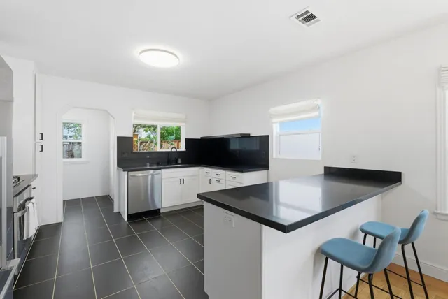 a kitchen with a counter top space and a sink