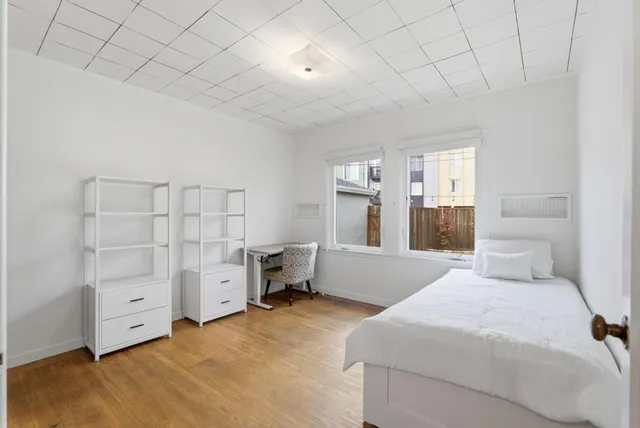 a bedroom with a bed and cabinets