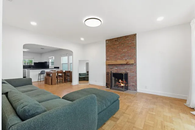 a living room with furniture and fireplace