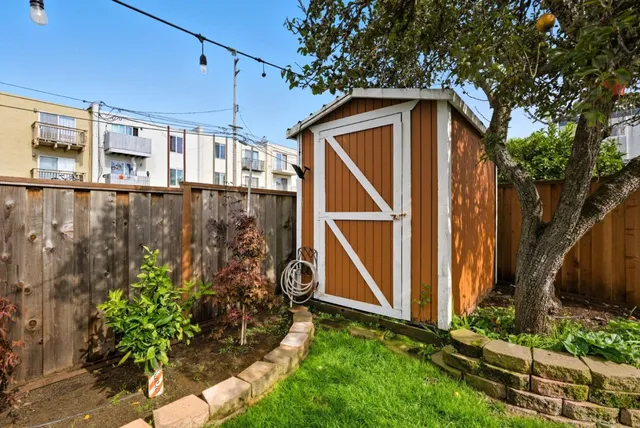 a blue house with trees in front of it