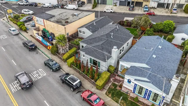 an aerial view of a house with a yard