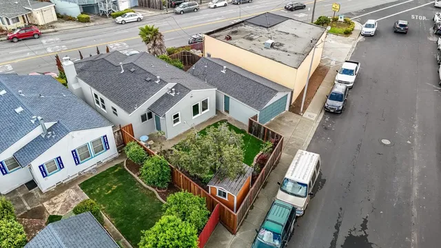 an aerial view of residential houses with outdoor space