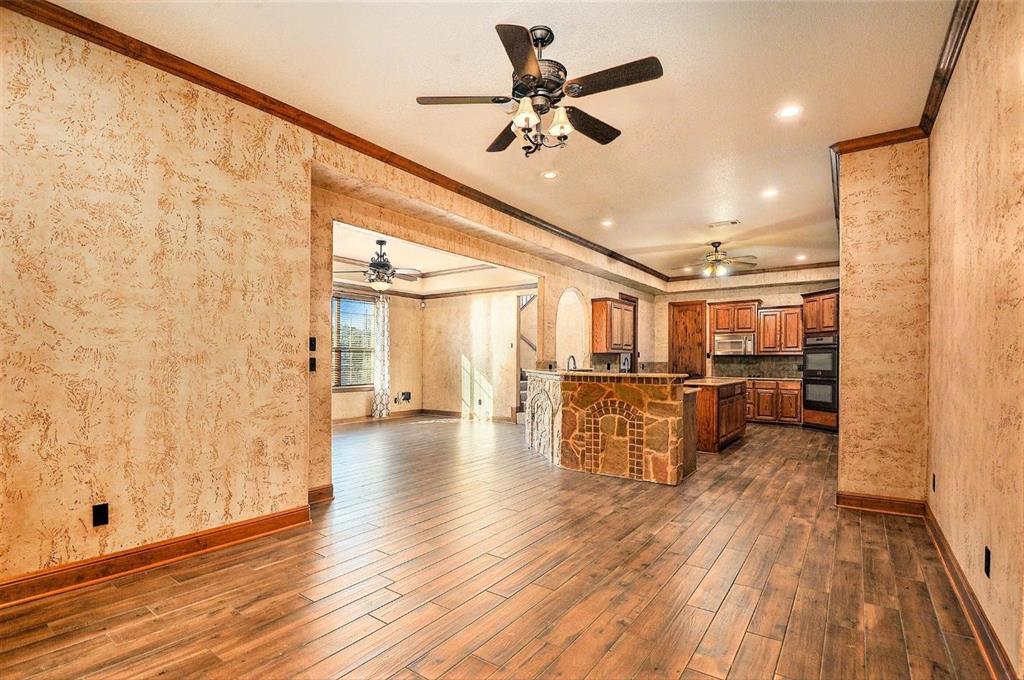 112 Bonita Drive Springtown, TX 76082 - Photo 12 of 39 a view of a hallway with wooden floor