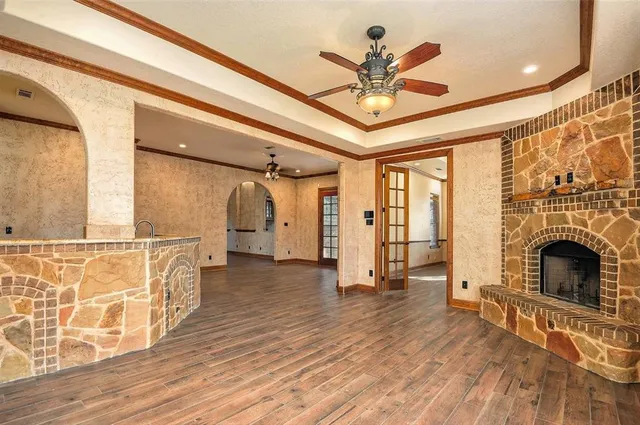 a view of livingroom with fireplace and wooden floor