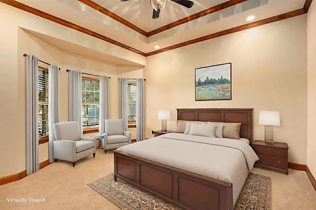 a spacious bedroom with a bed a couch and a window