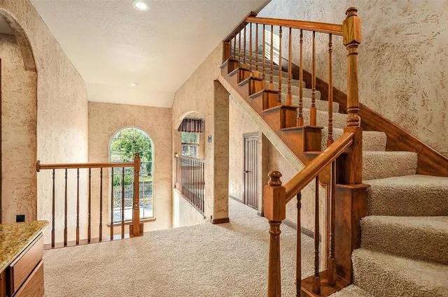 a view of entryway livingroom and hall with wooden floor