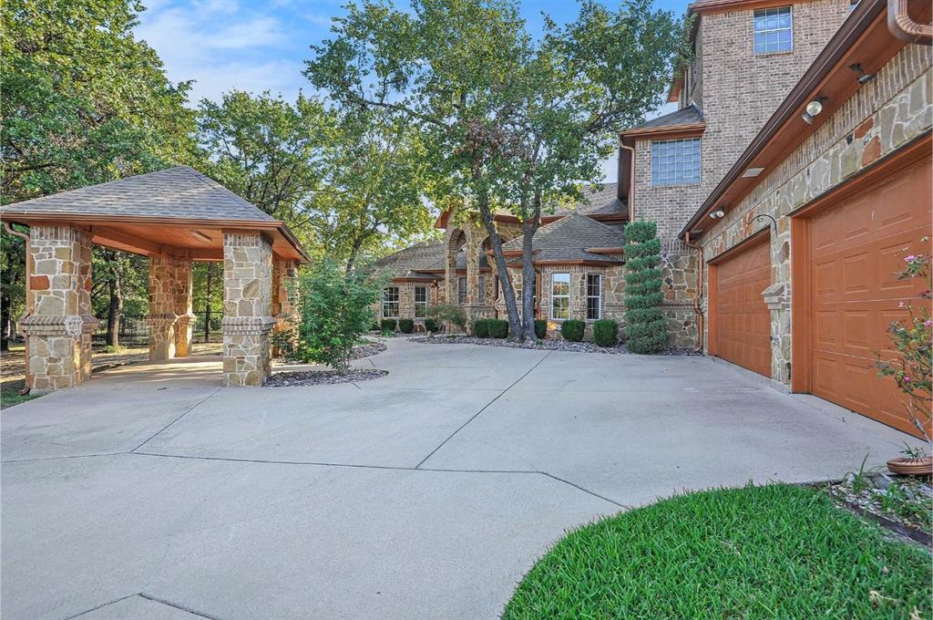 112 Bonita Drive Springtown, TX 76082 - Photo 3 of 39 a front view of a house with a yard and garage