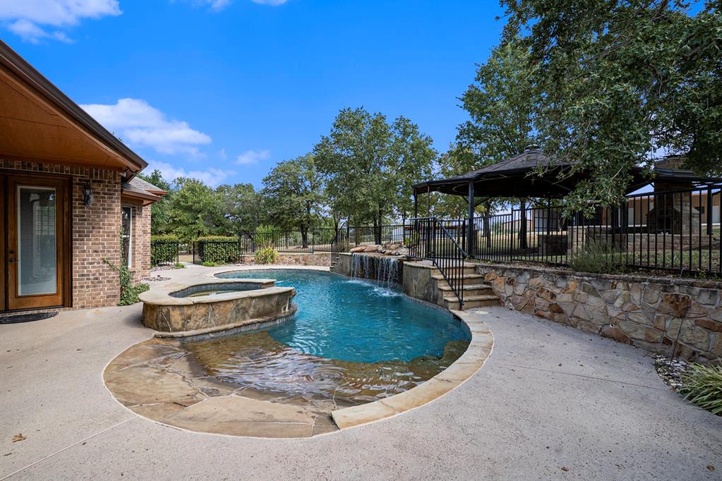 112 Bonita Drive Springtown, TX 76082 - Photo 32 of 39 a view of a house with swimming pool